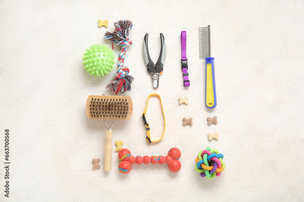 Composition with different pet care accessories and food on light background