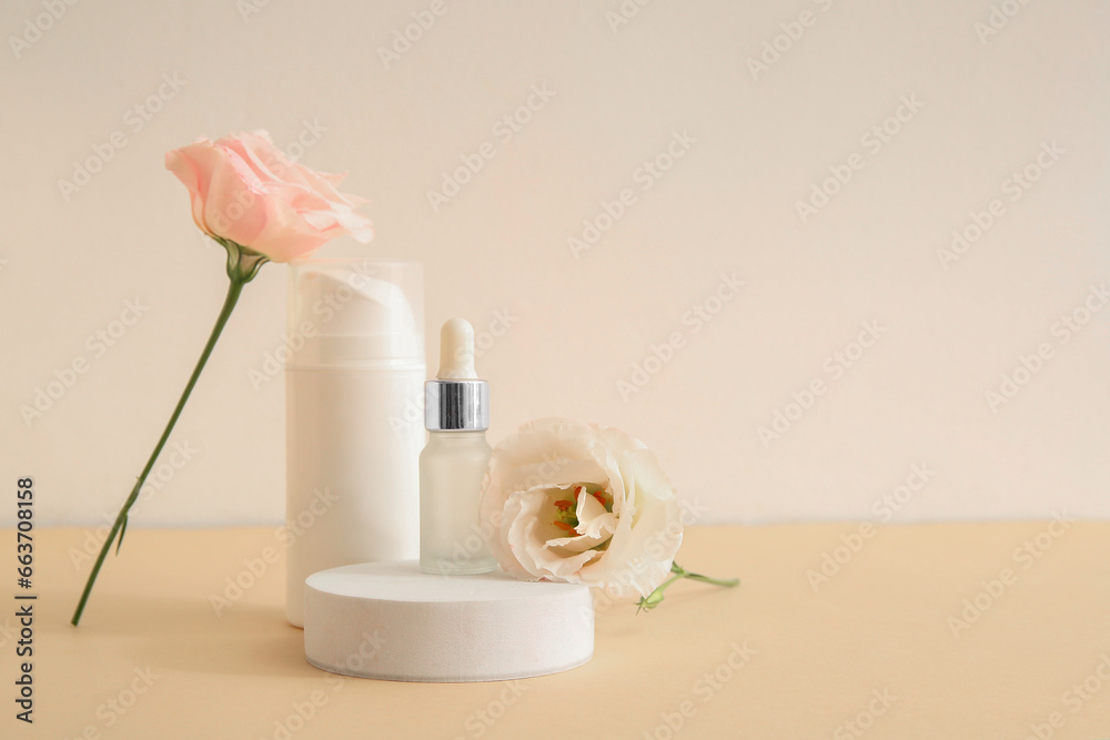 Composition with different cosmetic products, plaster podium and beautiful eustoma flowers on beige background