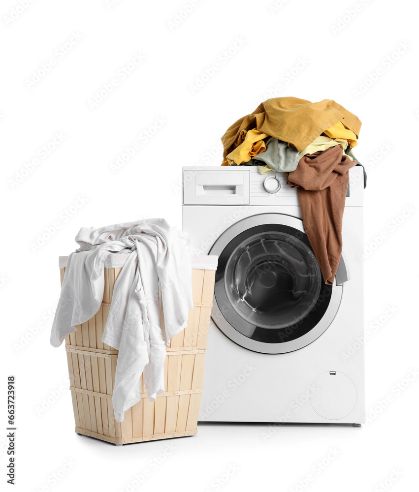 Basket and washing machine with dirty laundry on white background