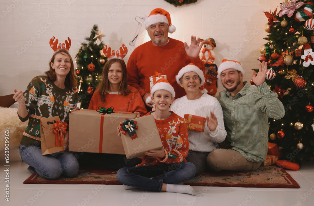 Christmas and New Year 2024 holiday concept, celebration of family, people. Smiling friends happily eating Christmas dinner at home in the evening.