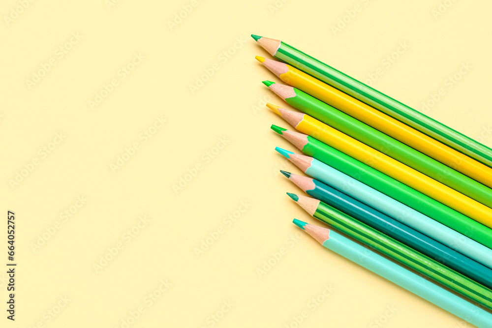 Row of different pencils on color background