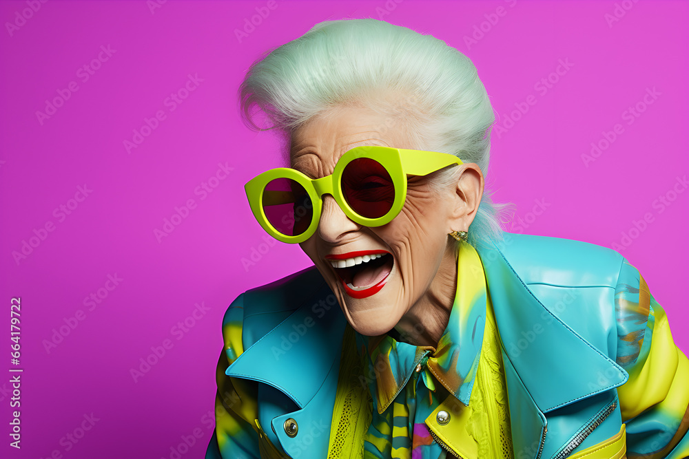 Happy senior woman in colorful neon outfit, funny sunglasses and extravagant style, laughing and smiling, 