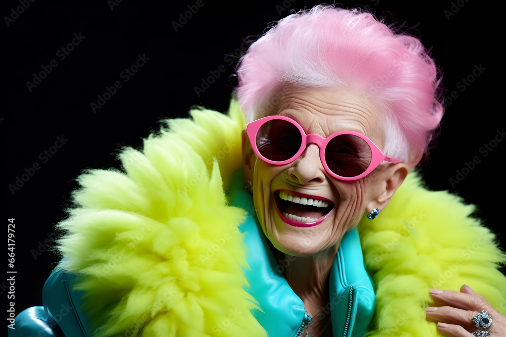 Happy senior woman in colorful neon outfit, funny sunglasses and extravagant style, laughing and smiling, 