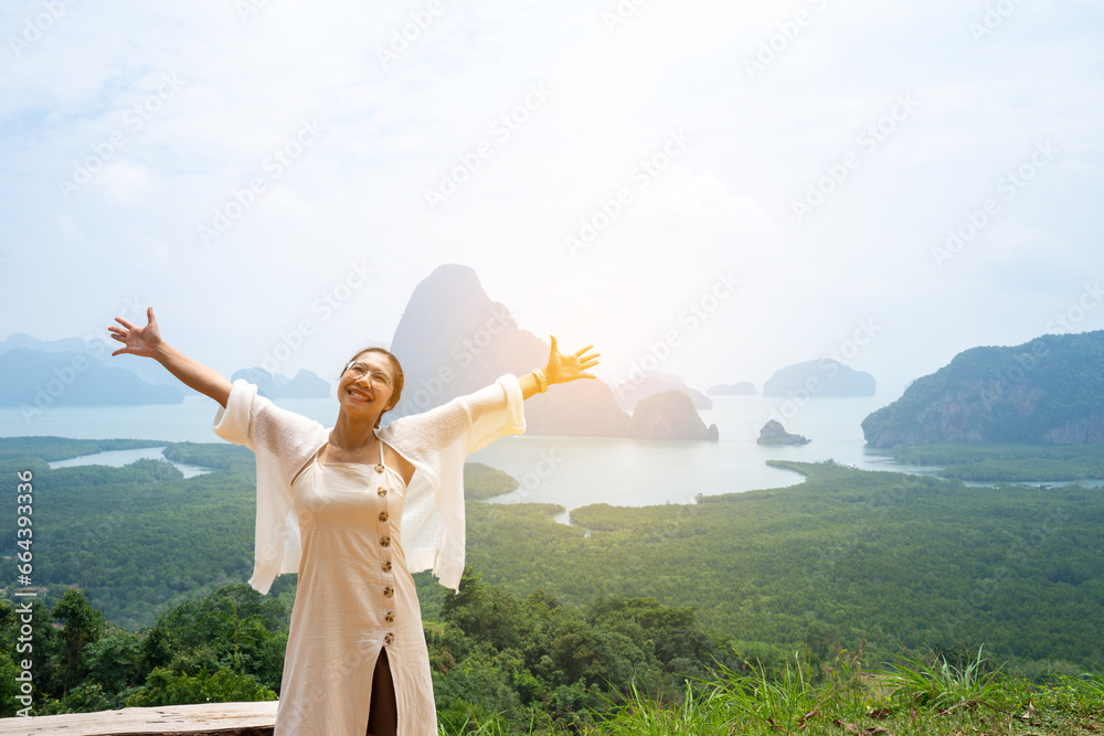 beautiful Refreshed woman in the Park Graden. Happy woman at Samet Nangshe Viewpoint park of Thailand.