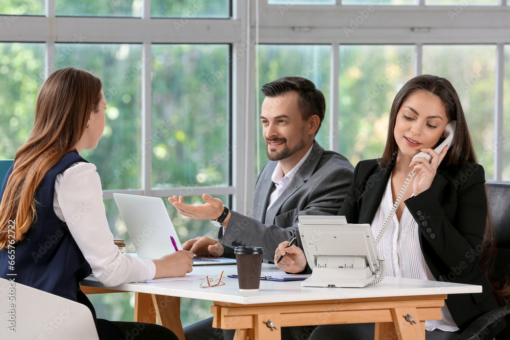 Human resources commission interviewing female applicant in office