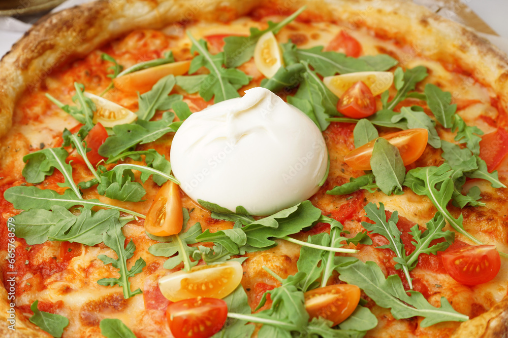 Tasty pizza with Burrata cheese on table, closeup