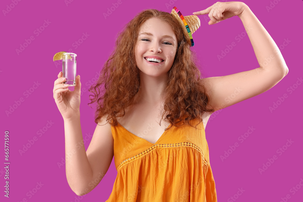 Happy Mexican woman with tequila on purple background