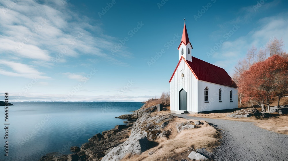 Quaint and simple Lutheran church surrounded by a serene body of water. The water could be a sea, ocean, or lake, adding to the tranquility of the scene. Minimalist architecture and natural beauty