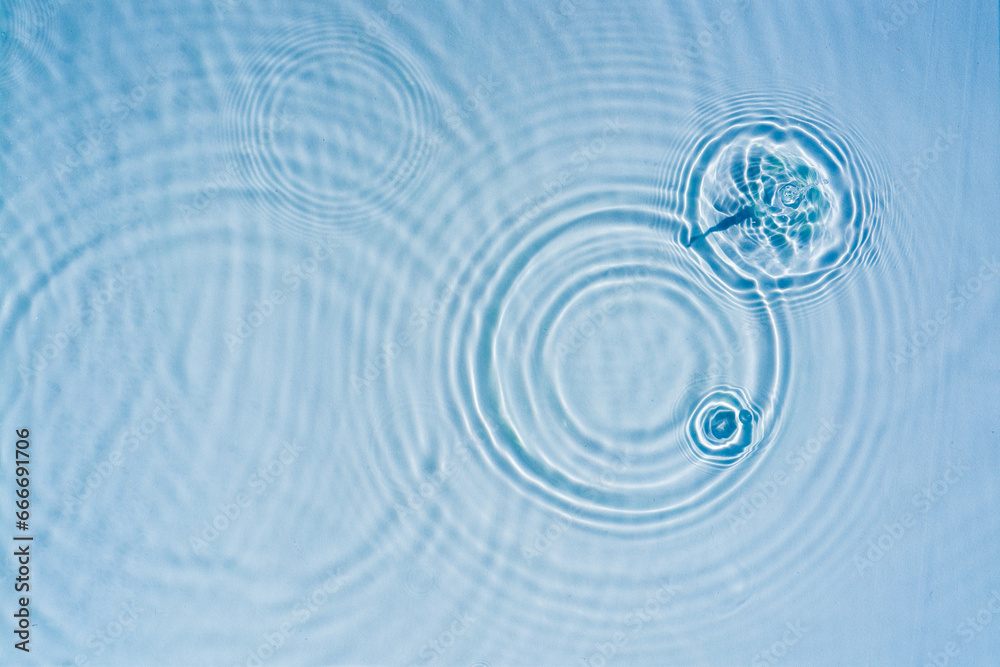 Beautiful pattern of circles of drops on a background of water Cosmetic moisturizing essence Abstract natural backdrop