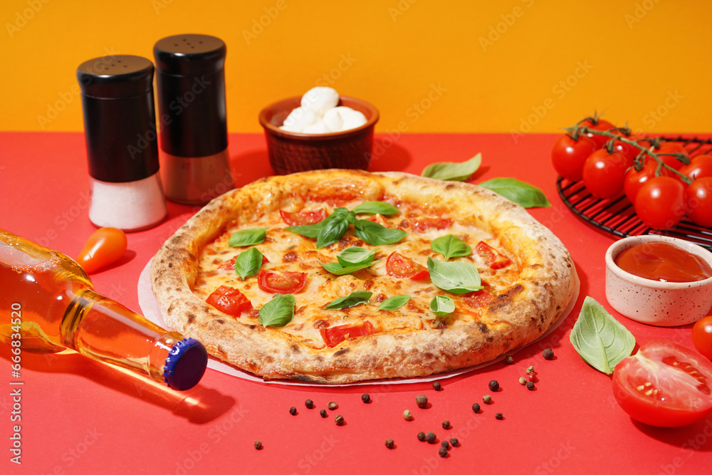 Tasty pizza Margarita with tomatoes and basil on red table