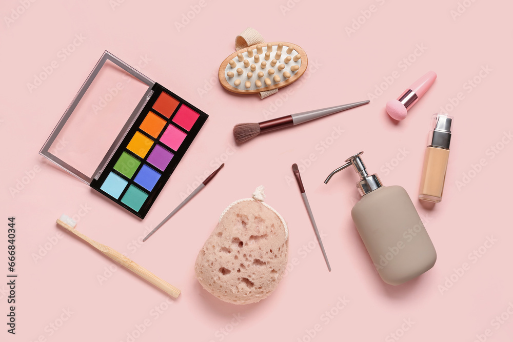 Composition with bath supplies and decorative cosmetics on pink background