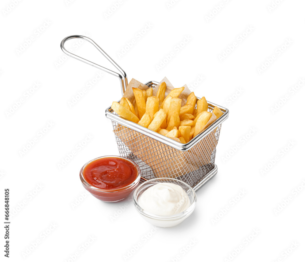 Basket for deep fryer with tasty french fries and sauces on white background