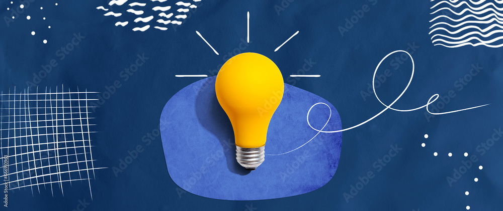 Yellow light bulb with handwritten sketch - flat lay