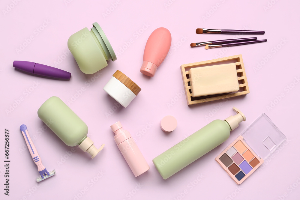 Set of different cosmetic products on lilac background