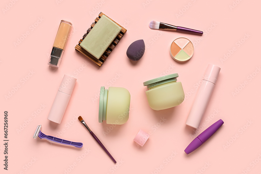 Set of cosmetic products and makeup accessories on color background