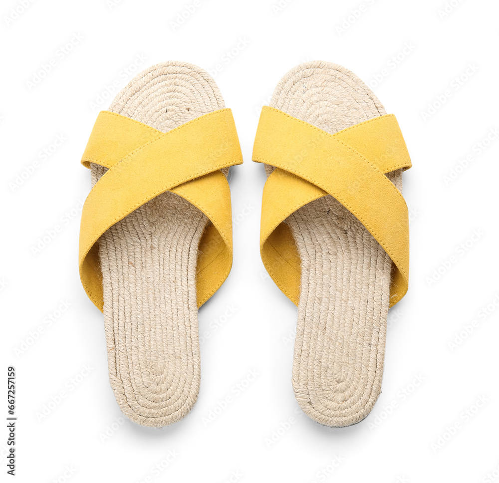 Stylish yellow sandals on white background