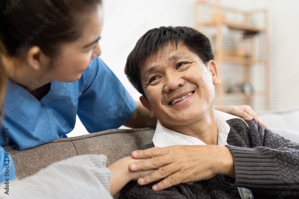 elderly touch hand on back of hand caregiver or nurses to express thankful