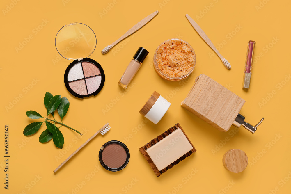 Composition with different cosmetic products and toothbrushes on color background