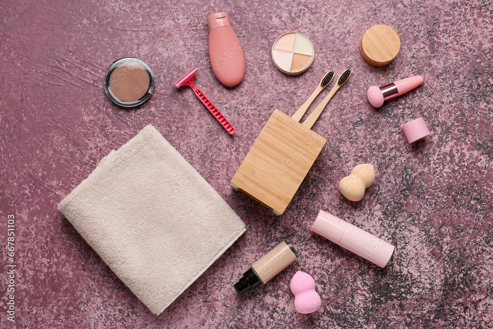 Composition with cosmetic products and bath accessories on color background