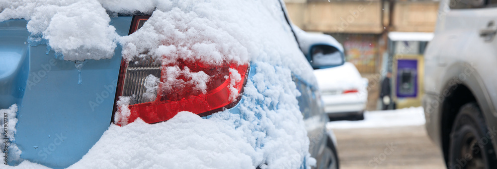 car is covered with snow