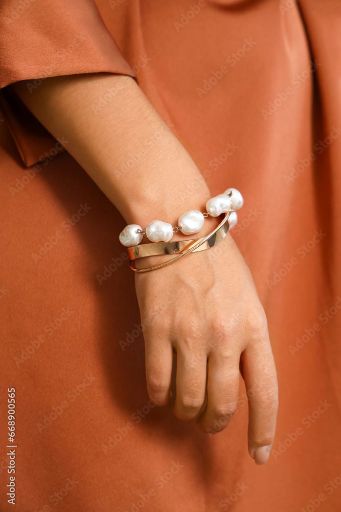 Beautiful young Asian woman with stylish bracelets, closeup