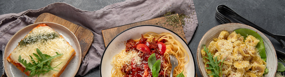 Assortment of Italian pasta with traditional sauces for dinner. Homemade food concept.