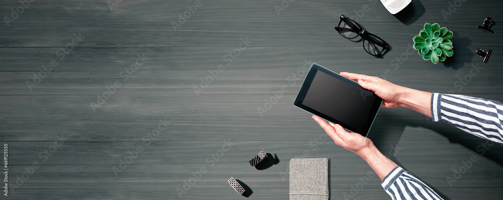 Woman using a tablet computer from above