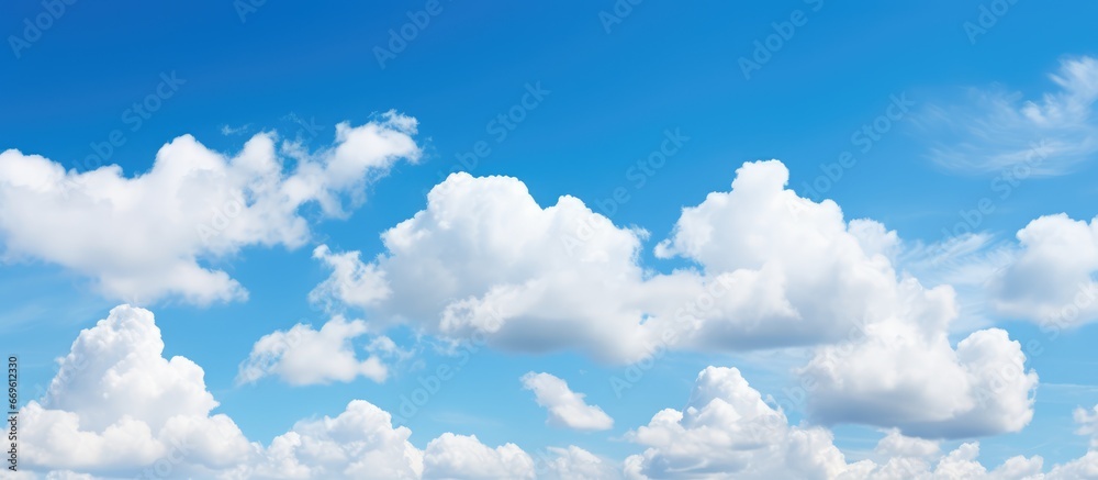 White cumulus clouds against a blue sky in their natural setting