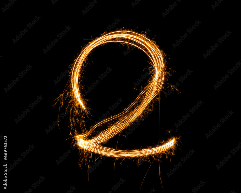 Fireworks numbers 2 Burning sparkler Numbers isolated on black background. Sparkler firework light alphabet 2 and number two. Numbers Alphabet of Sparklers