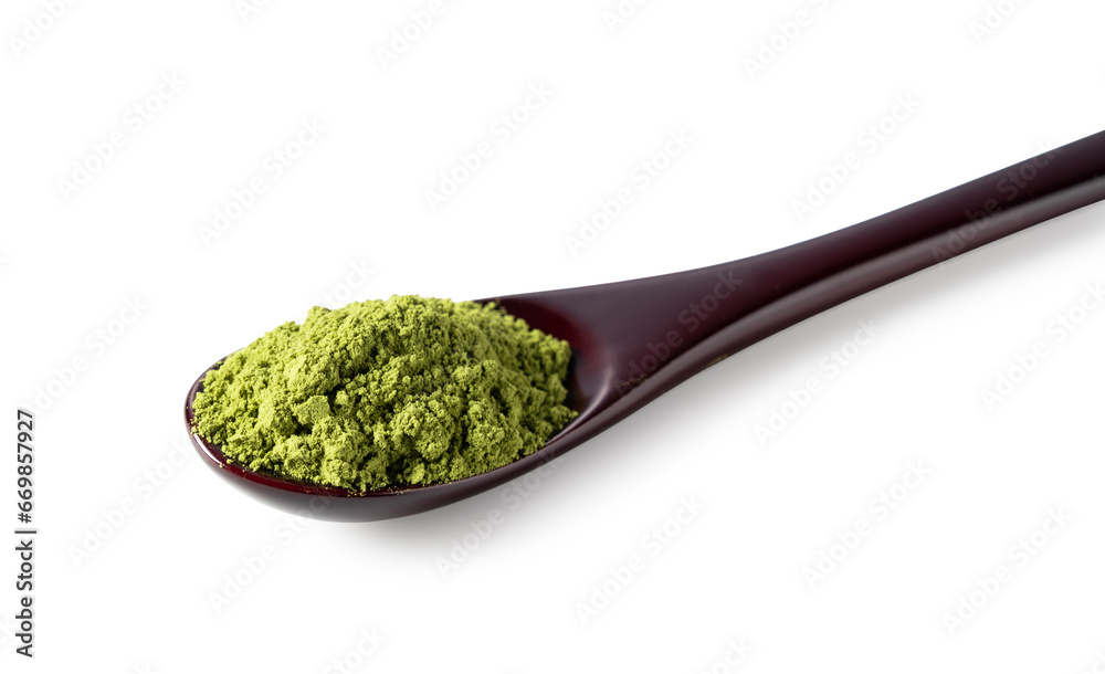 Matcha and wooden spoon on white background.