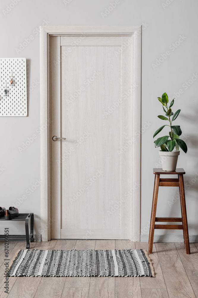 Interior of hall with door and pegboard