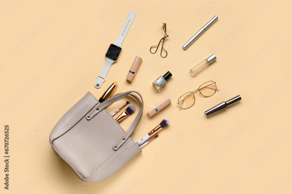 Composition with stylish female handbag, cosmetics and accessories on color background