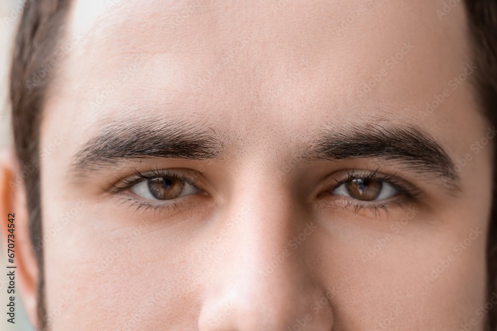 Young man with hazel eyes, closeup