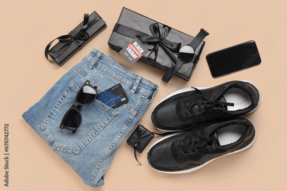 Composition with stylish male shoes, gadgets and gifts on color background. Black Friday sale