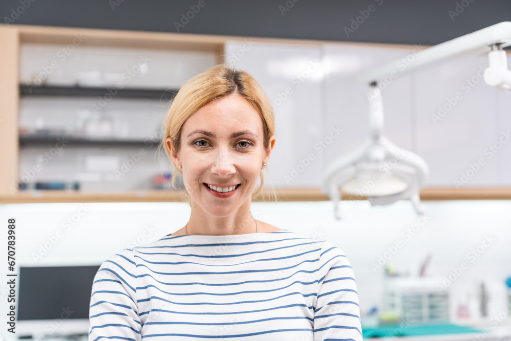 Portrait of Caucasian woman patient and dentist at health care clinic. 