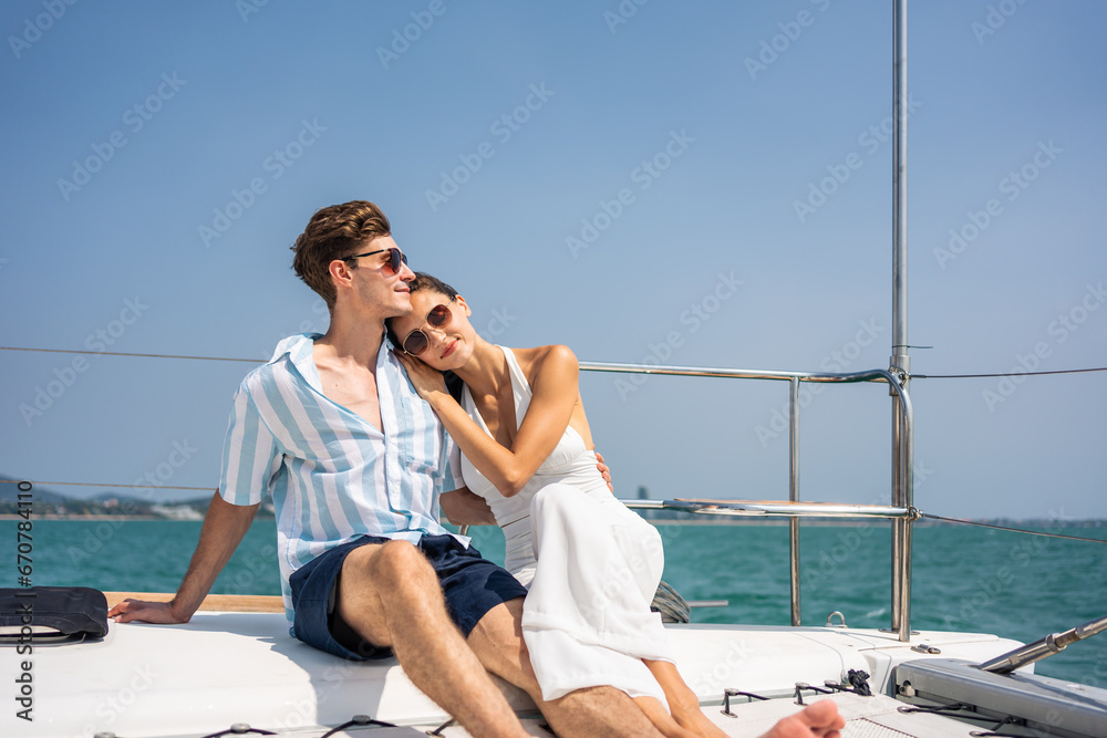 Caucasian romantic couple looking at beautiful view during yachting. 