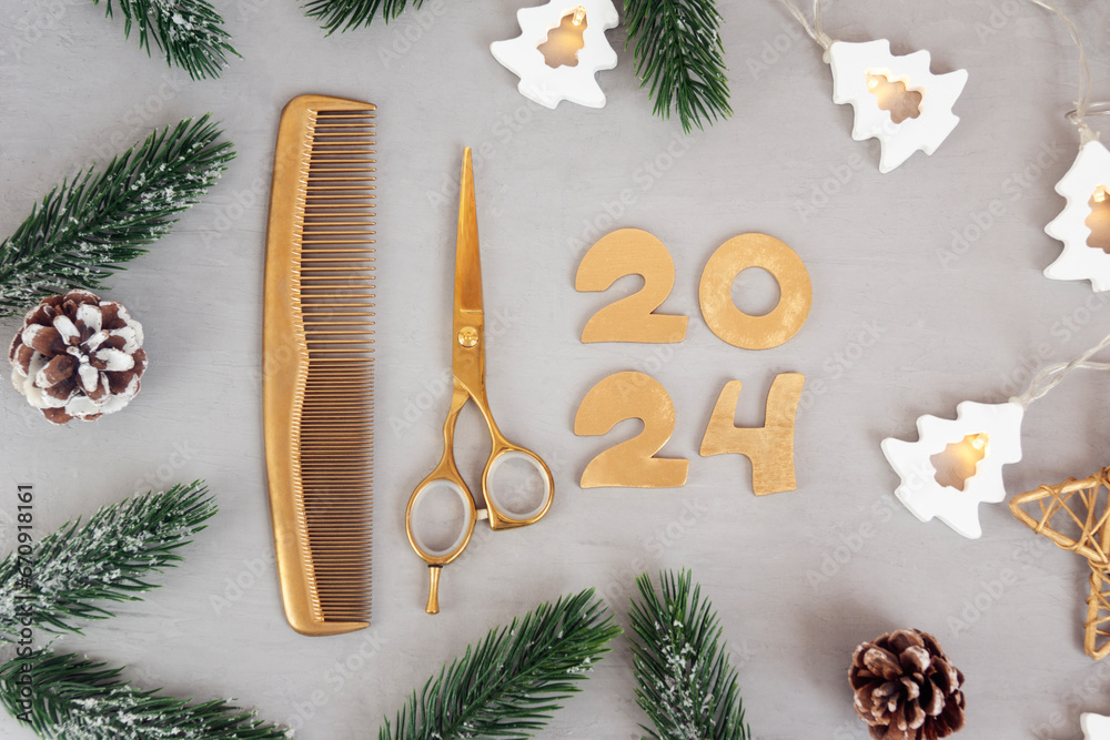 Numbers 2024 golden colored scissors and comb with fir twigs on gray background. Template greeting c