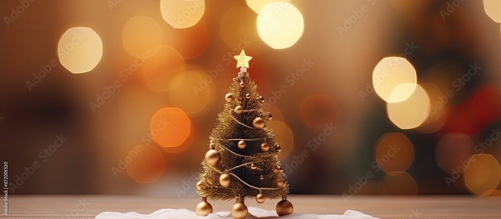 A Christmas tree is shown in a room with a blurred background