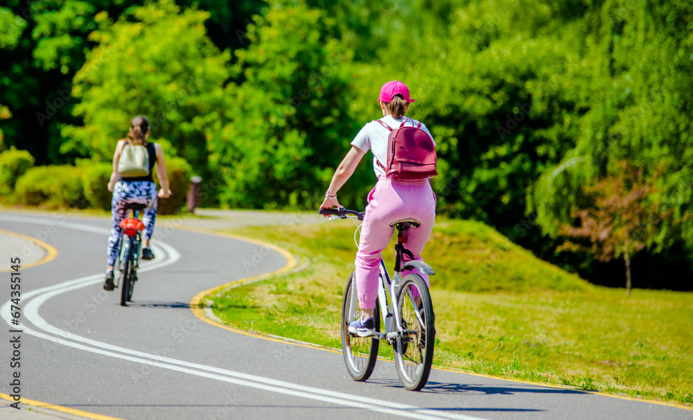 Cyclist ride on the bike path in the city Park 