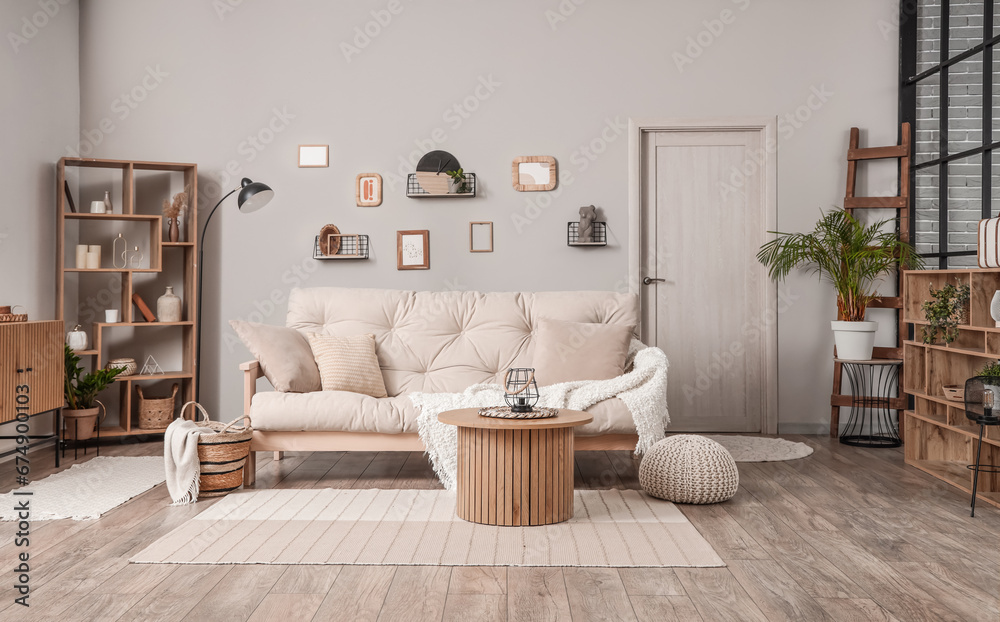 Interior of light living room with couch and coffee table