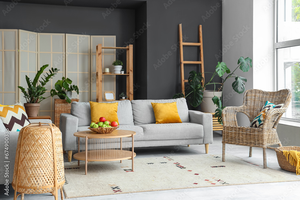 Interior of modern living room with sofas and apples on table