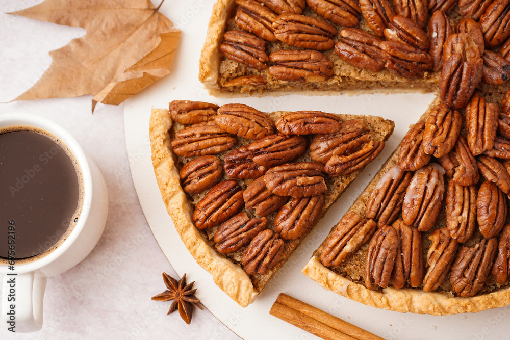 Tasty pecan pie and cup of coffee on light background