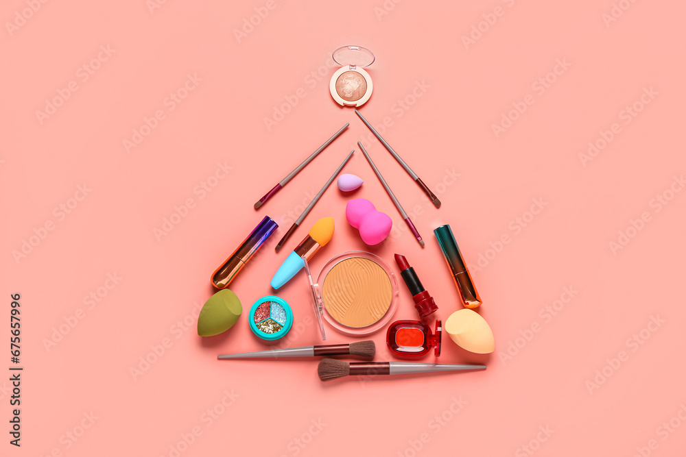 Beautiful Christmas tree made of makeup cosmetics on pink background