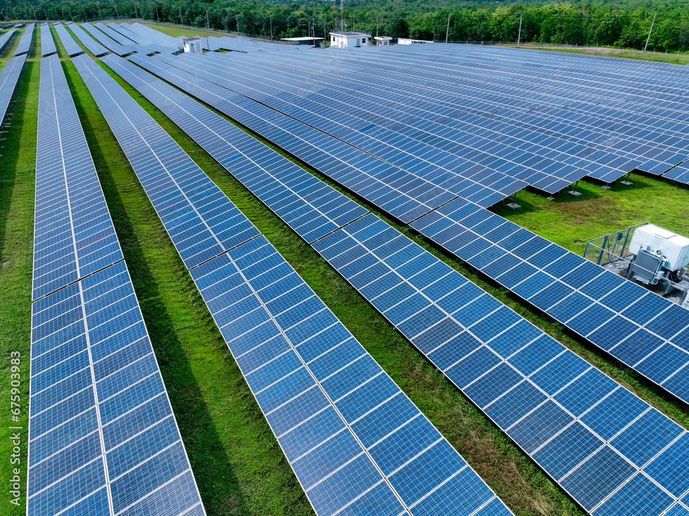 Aerial view of solar farm. Solar power for green energy. Sustainable resources. Solar cell panels use sun light as a source to generate electricity. Photovoltaics or PV. Sustainable renewable energy.