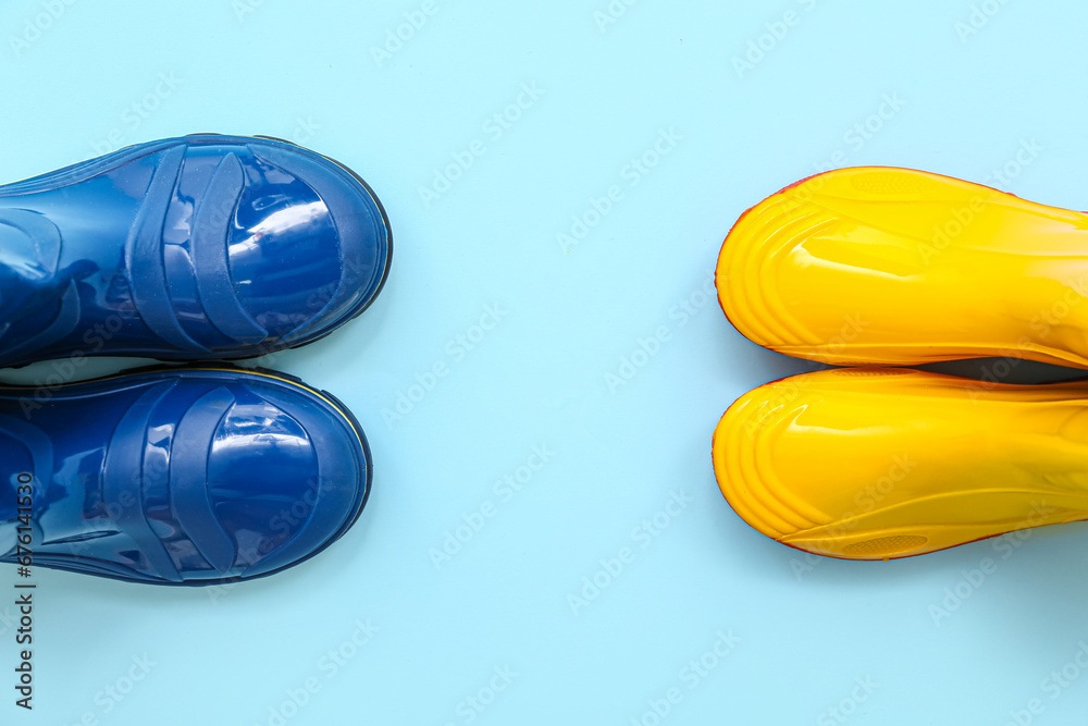 Different gumboots on blue background