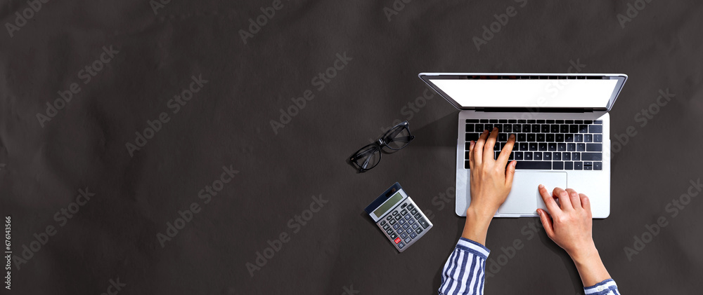 Person using a laptop computer from above