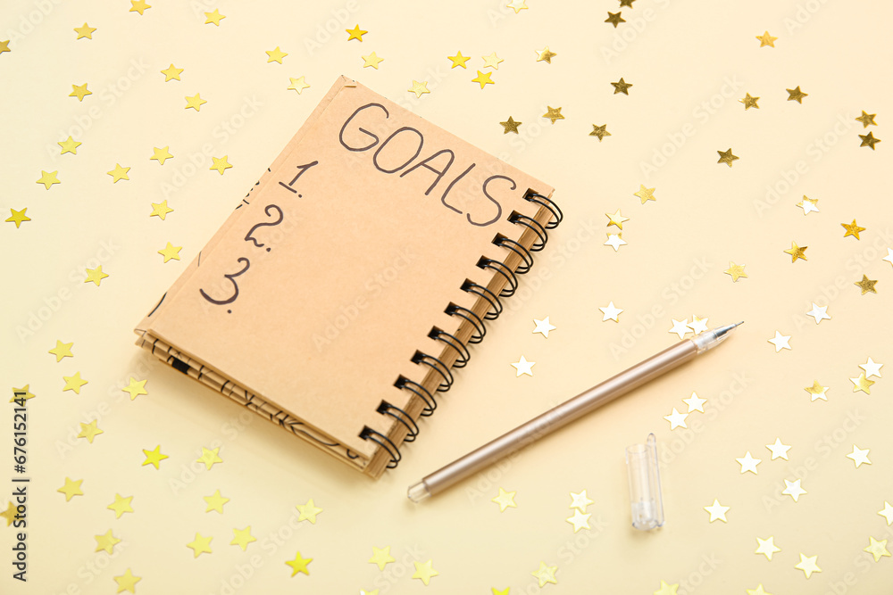 Notebook with empty to do list and confetti on light yellow background