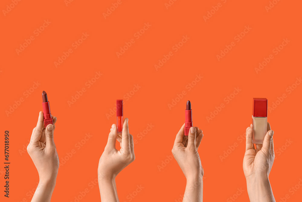 Women with lipsticks and makeup foundation on red background