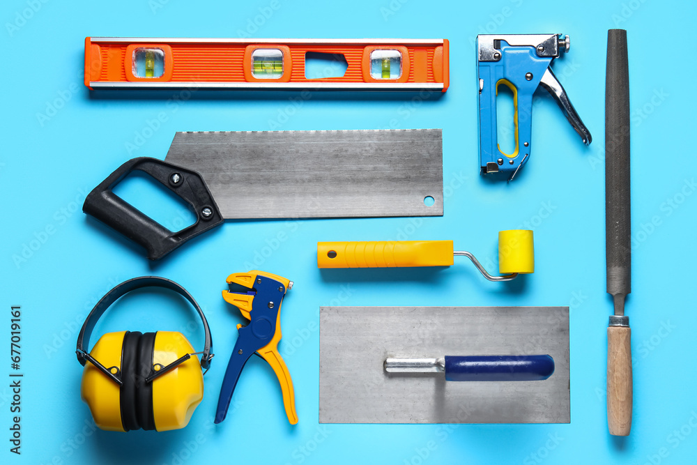 Set of construction tools on blue background