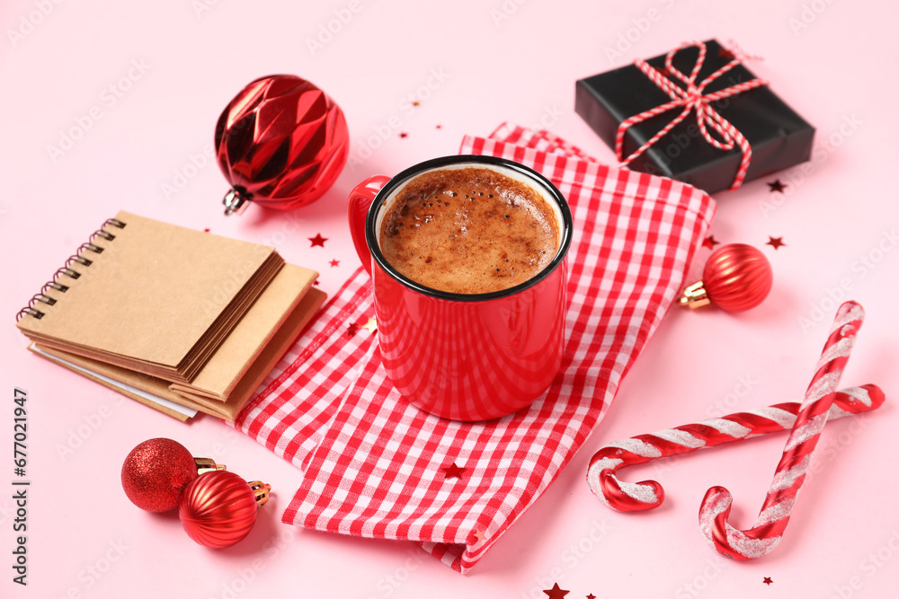 Beautiful composition with mug of coffee and Christmas decor on pink background